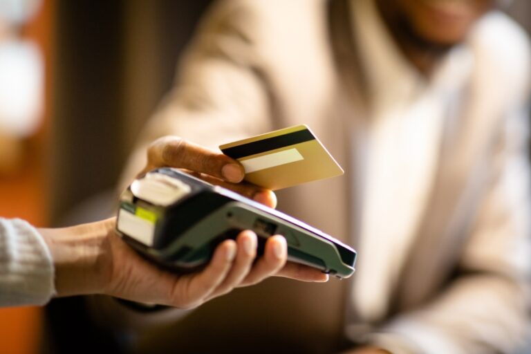 A customer paying his bill through credit card.